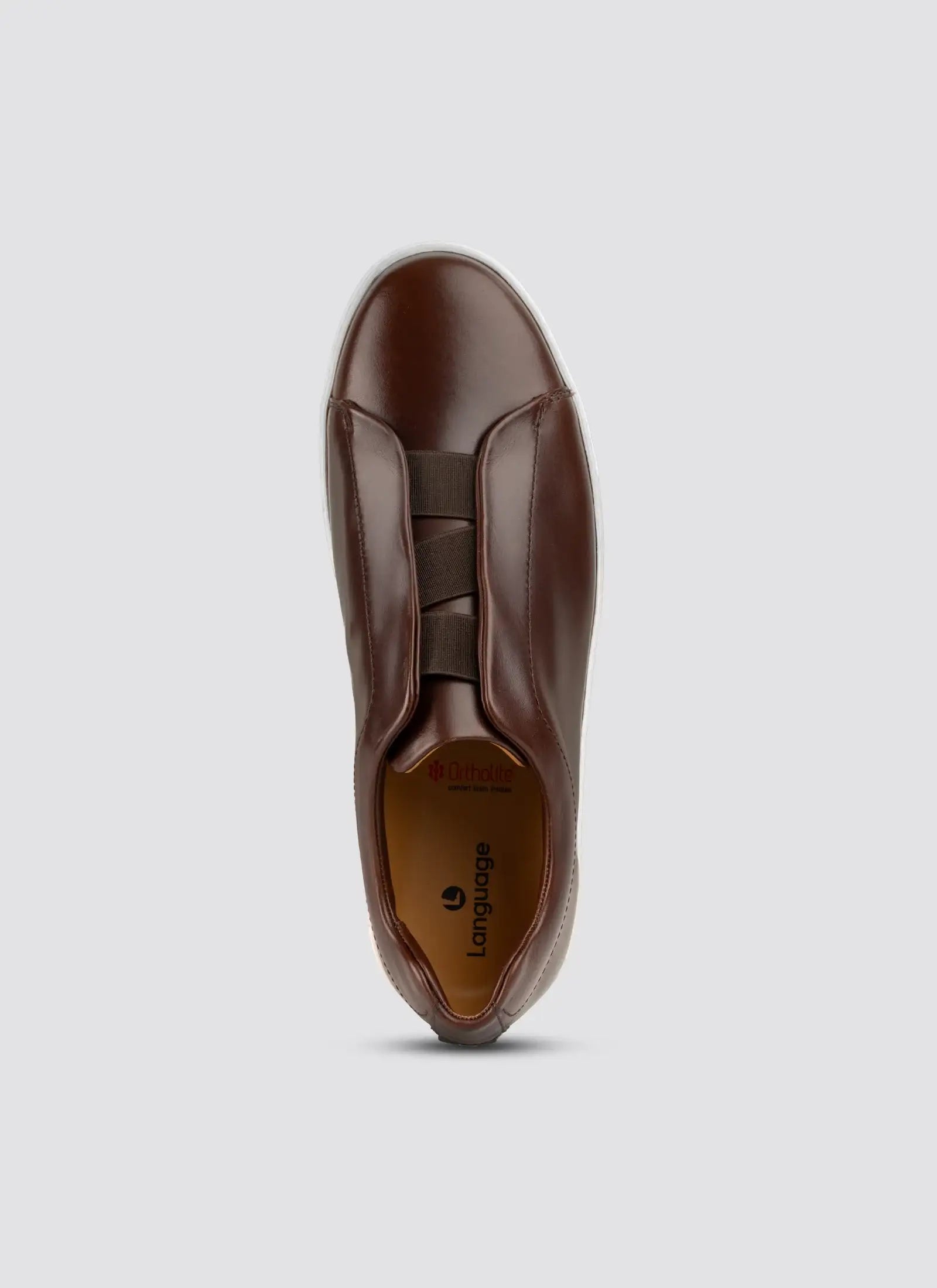 Brown leather shoe on a light gray background