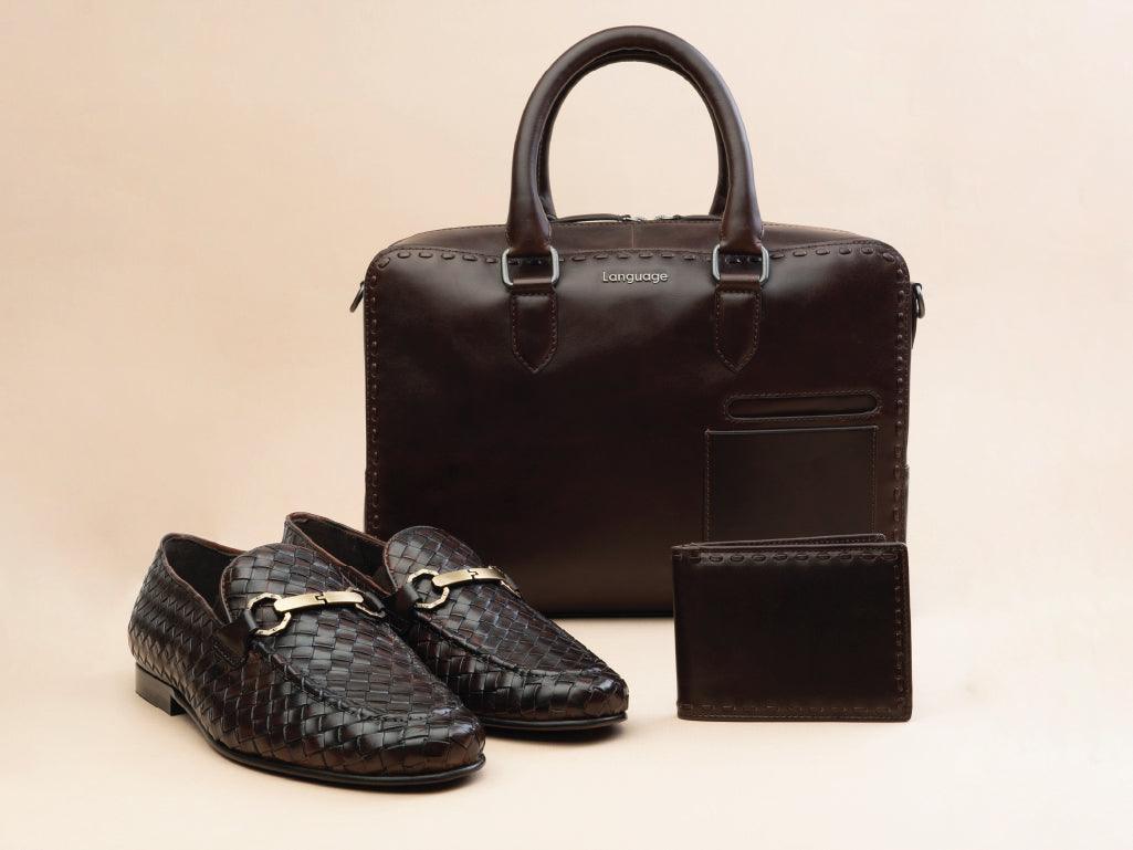 Dark brown leather briefcase, matching woven loafers, and wallet for men on beige background
