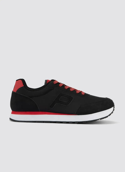 Black and red men's sneaker with lace-up closure, side logo detail, and white sole on plain background 