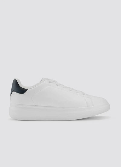 White leather sneaker with black heel accent, minimal lace-up design, side view on plain background 