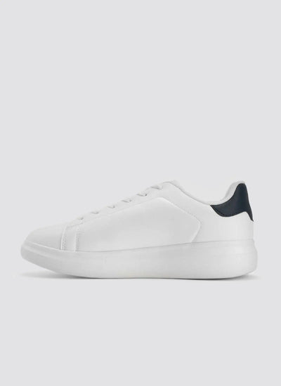 Minimalist white leather sneaker with black heel accent, side view, on white background 