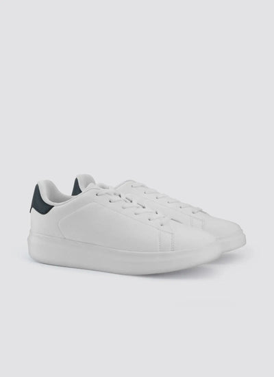 Pair of white low-top sneakers with black heel detail on a light background 