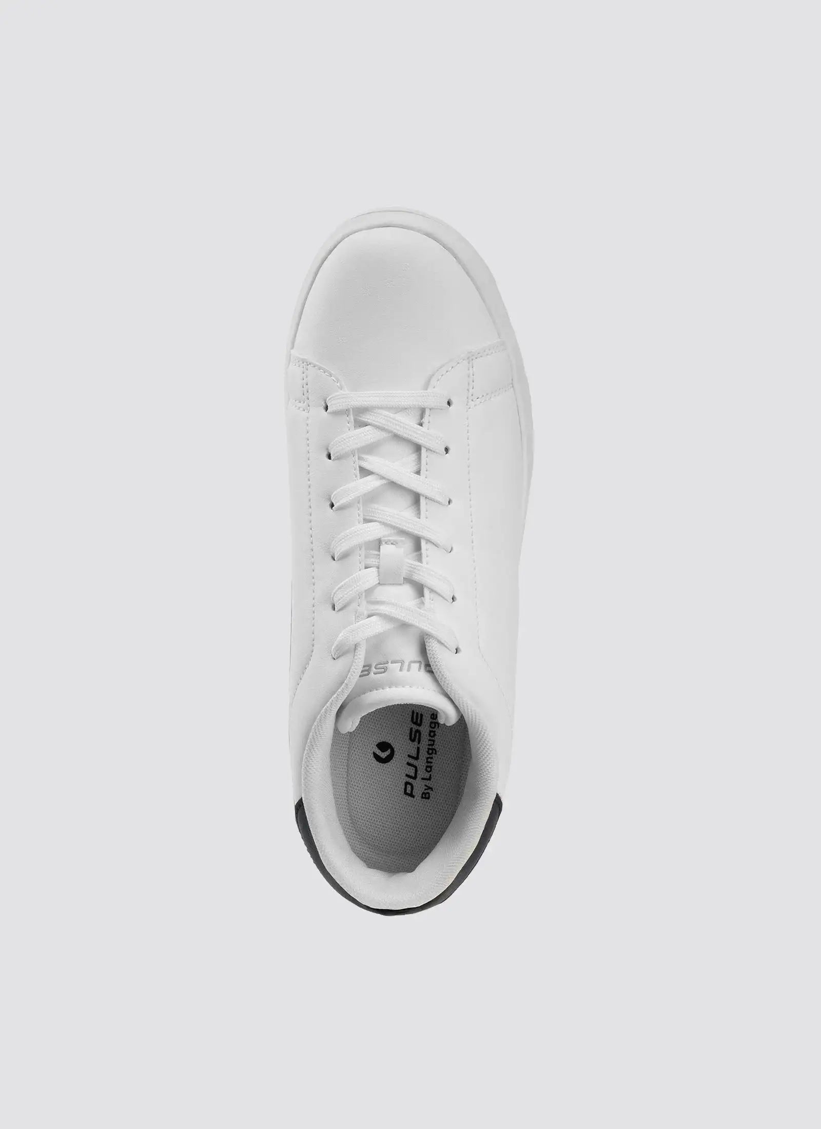 Top view of a white leather sneaker with laces on a plain light background 