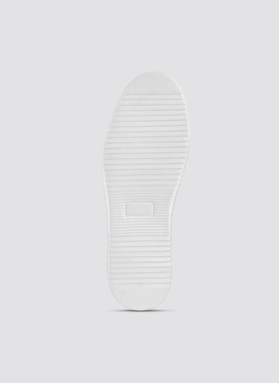 White rubber shoe sole with horizontal grooves, isolated on light background 