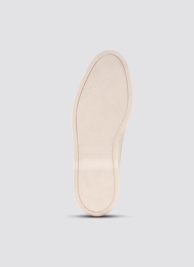 Beige shoe sole on a light gray background 