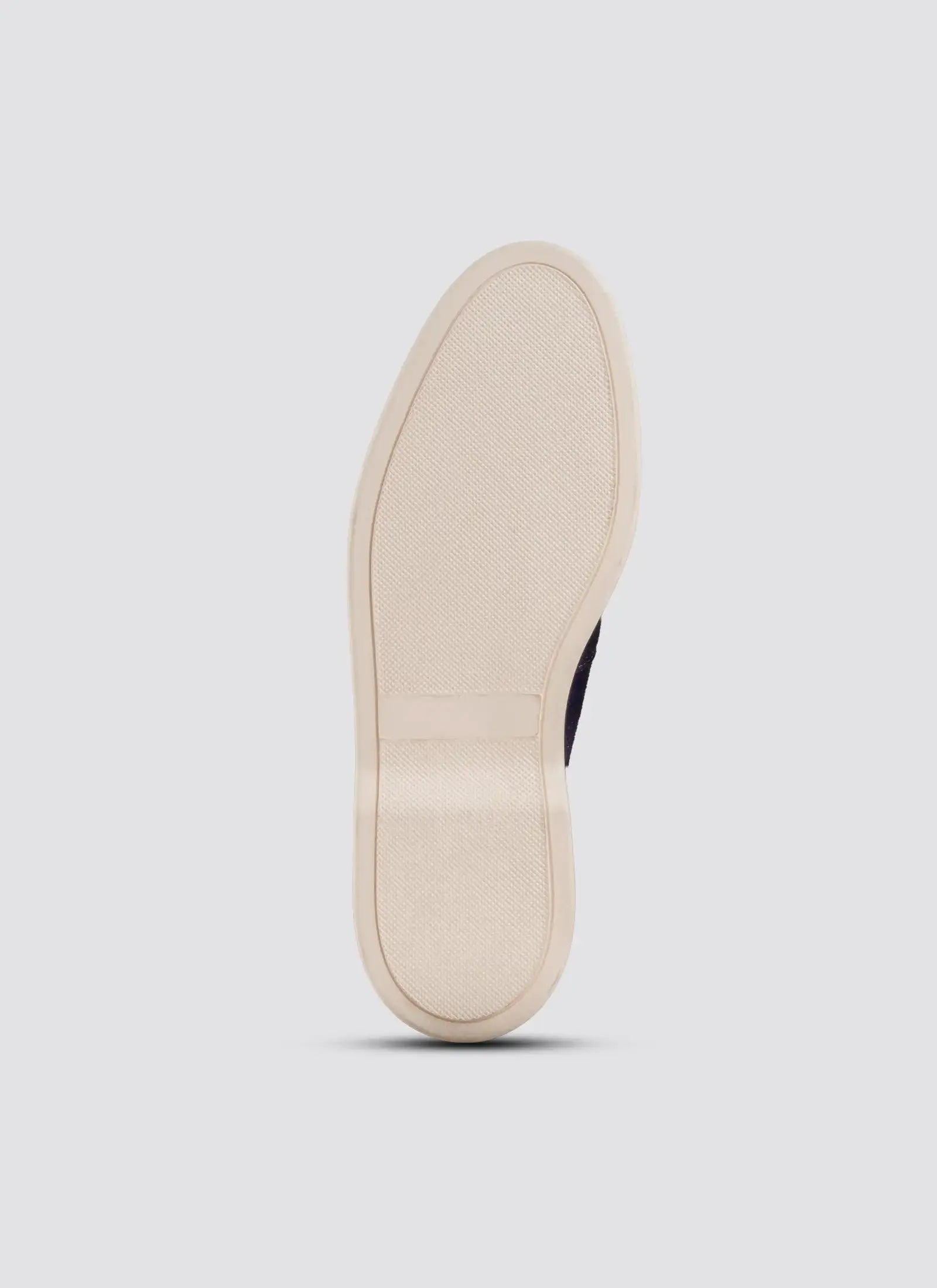 Beige sole of a shoe on a light gray background 