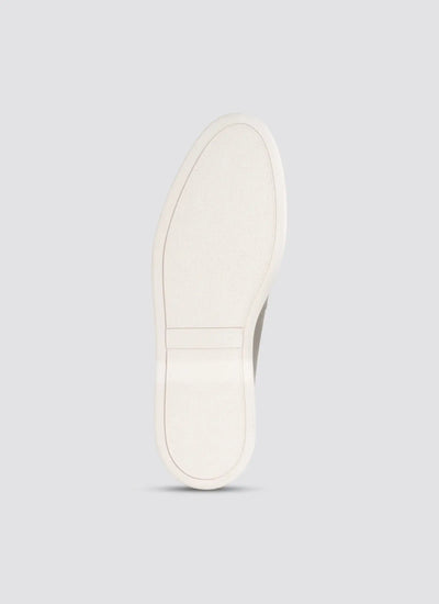 White sneaker sole on a light gray background 