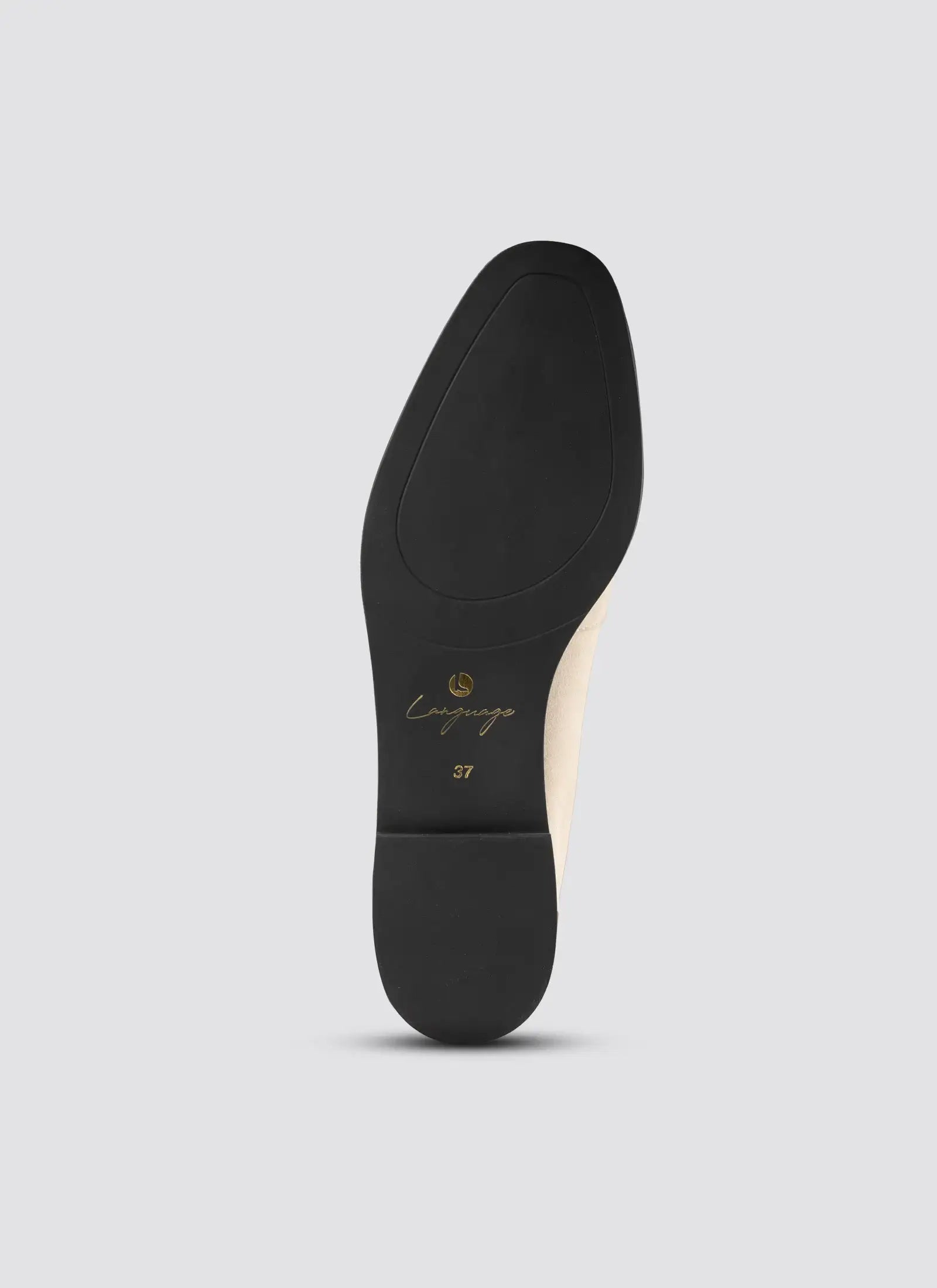 Black shoe sole with 'Camper' branding on a light gray background 