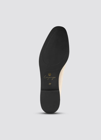Black shoe sole with 'Camper' branding on a light gray background 