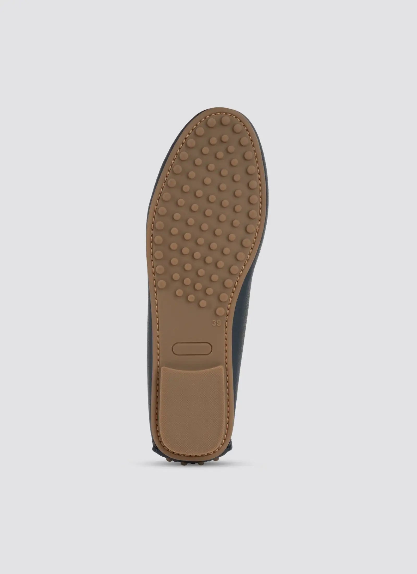 Brown shoe sole on a light gray background  