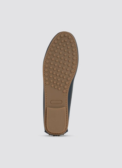 Brown shoe sole on a light gray background  