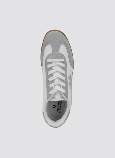 Top view of grey and white lace-up sneaker with suede accents, white sole, on plain background.  