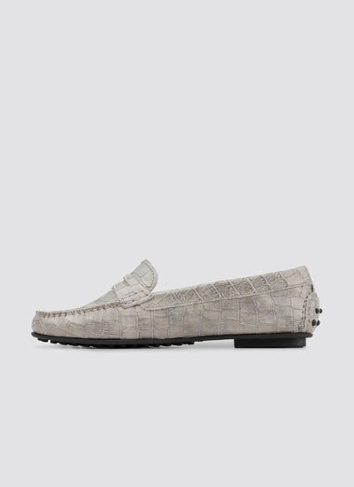 Gray loafers with textured pattern on a white background 