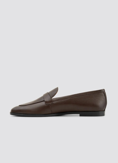 Brown loafer shoe on a light gray background 
