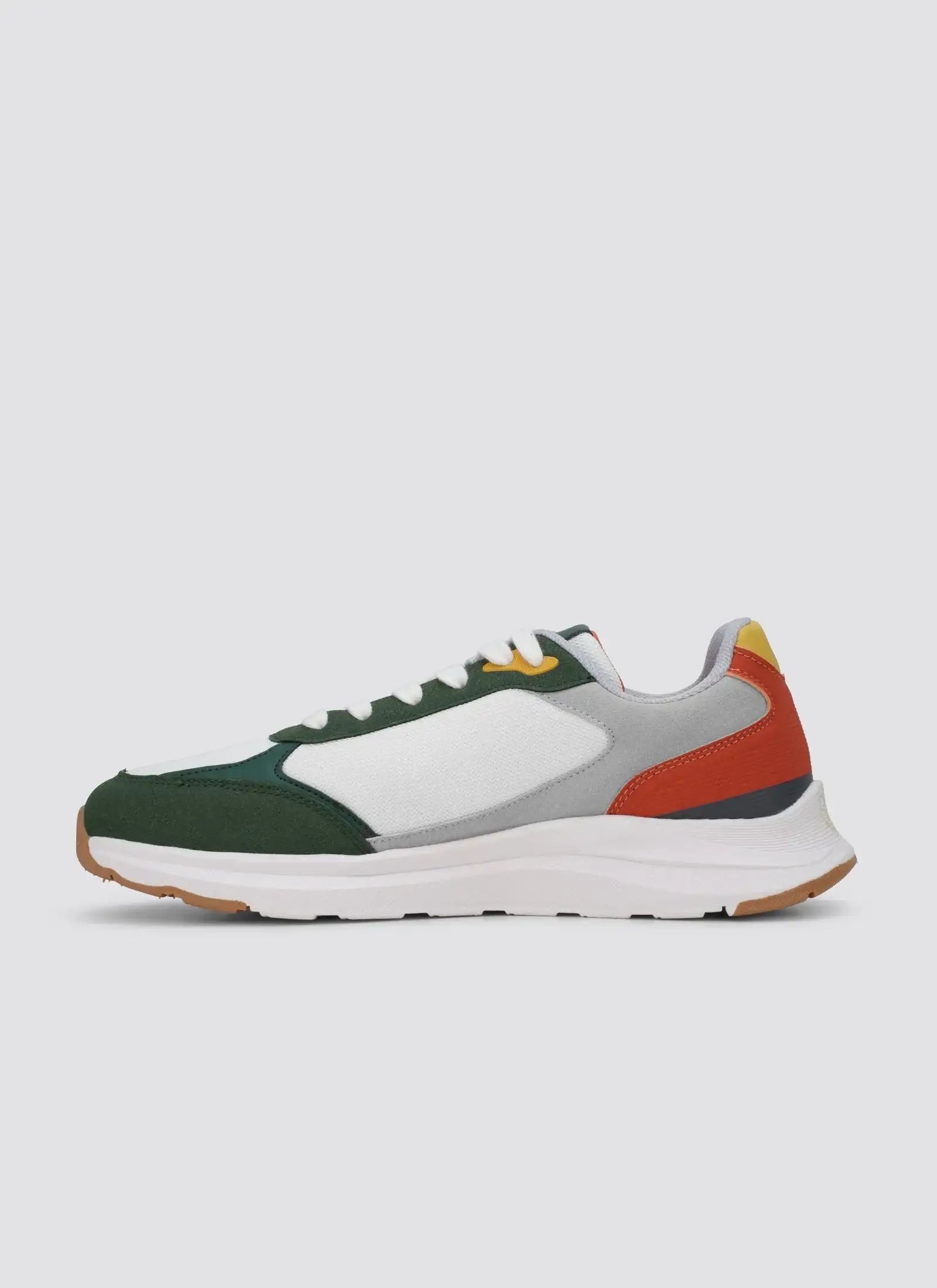 Men's white, green, grey, and red sneaker with white sole on plain background 