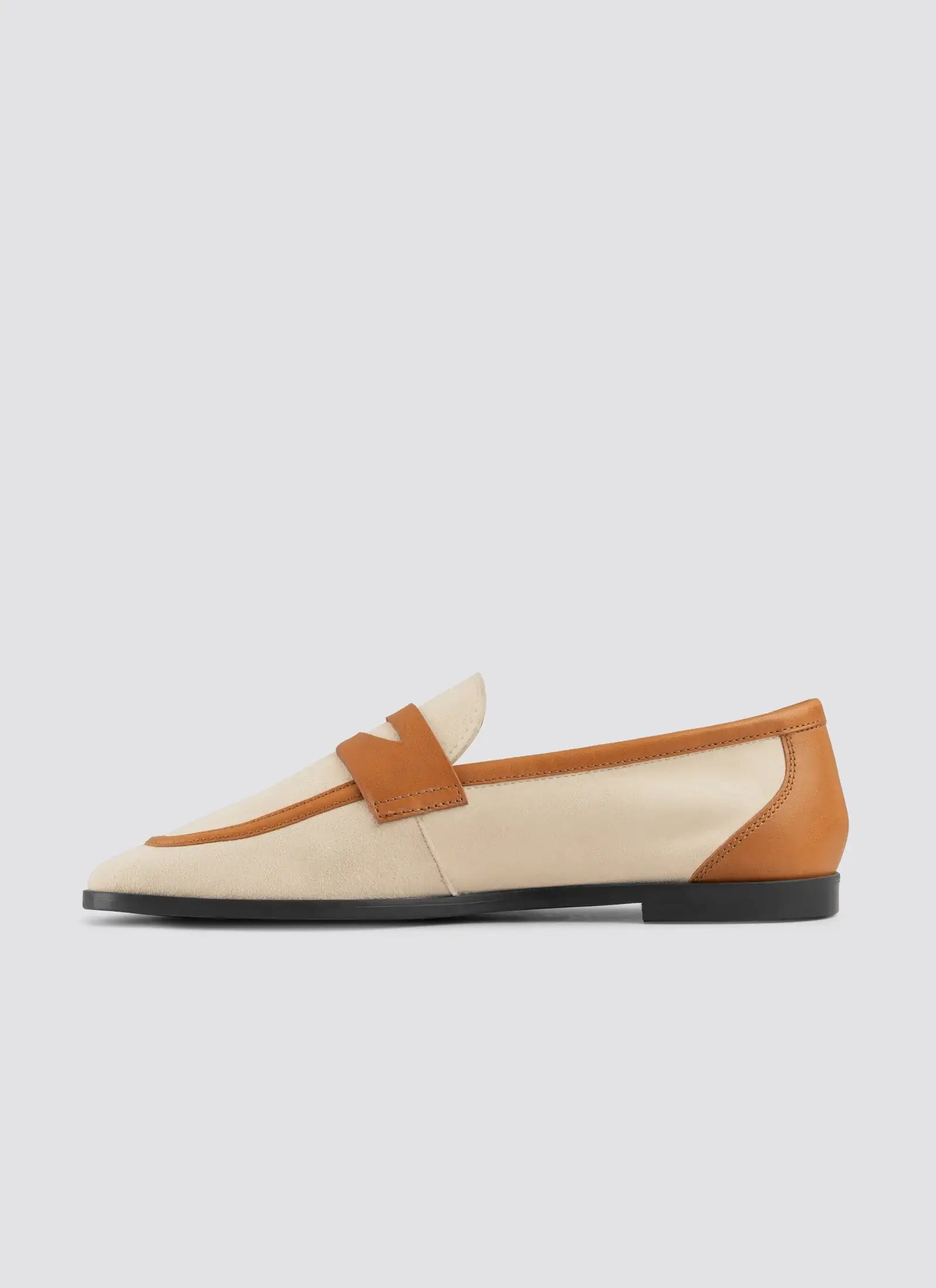 Loafer shoe with beige and brown color scheme on a light gray background 