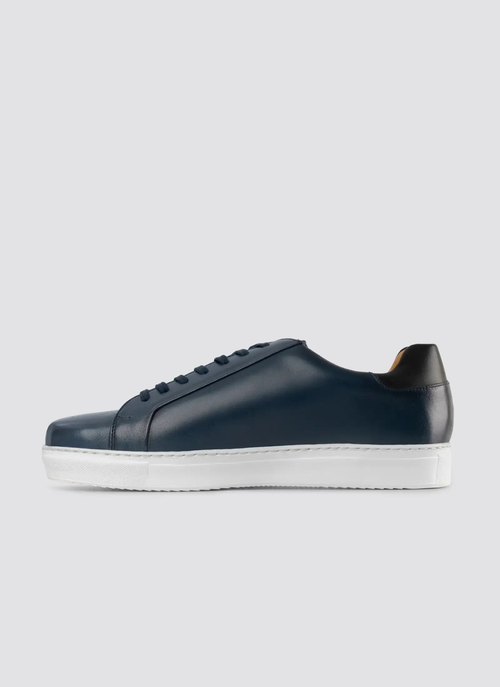 Men's navy blue leather sneaker with white sole, lace-up casual footwear 