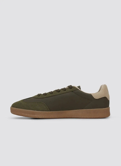 Olive green low top sneaker with beige heel accent and brown sole, casual footwear 