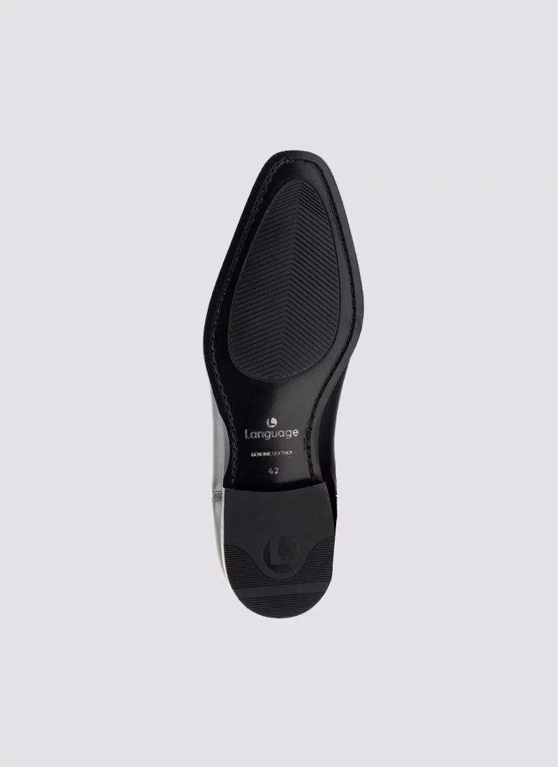 Black formal leather shoe sole with textured grip, viewed from the bottom, on grey background. 