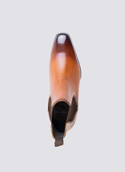 Top view of tan leather slip-on shoe with square toe and dark brown elastic side panel 