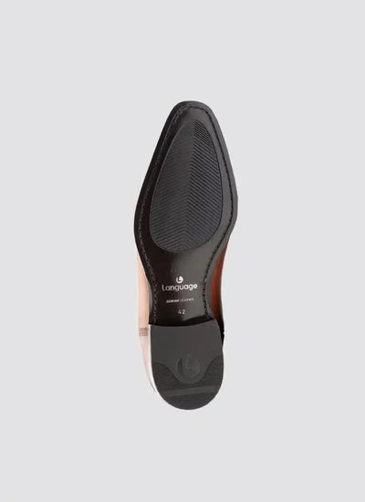 Sole view of tan genuine leather men's dress shoe with black rubber sections, size 42 