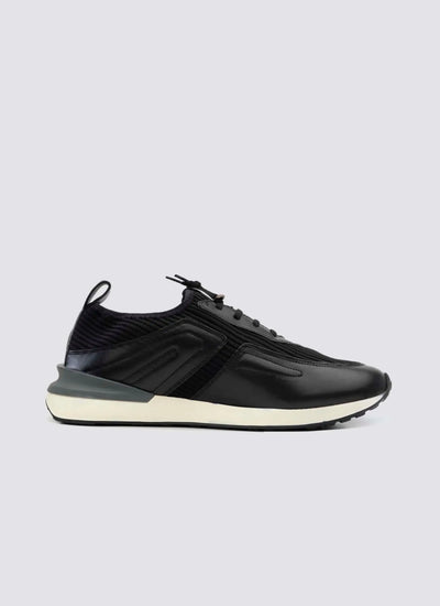 Men's black leather sneaker with white sole, side view, modern athletic footwear 