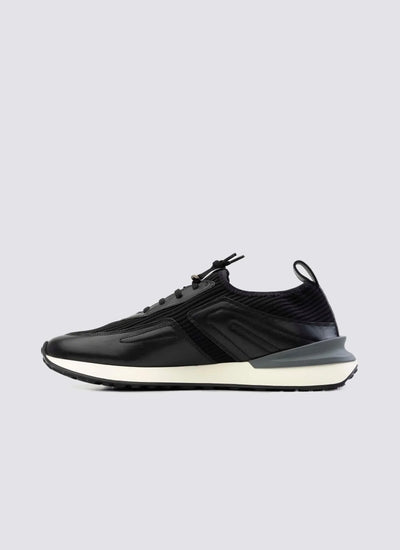 black men's sneaker with white sole, side view, modern athletic footwear on white background 