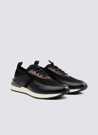 Pair of navy blue men's sneakers with black detailing and white soles on a plain background 