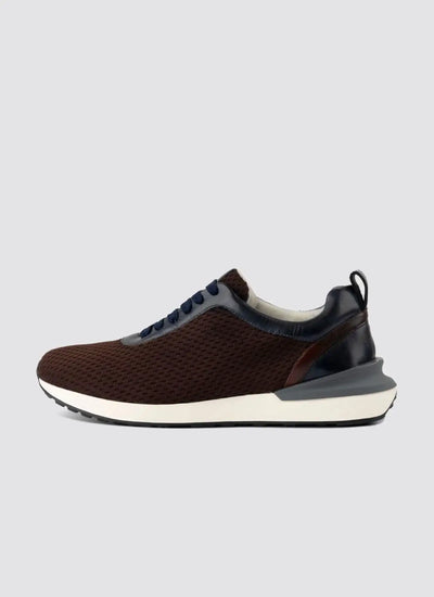 Men's brown mesh sneaker with navy accents and white sole, side view on grey background 