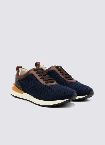 Men's navy blue mesh sneakers with brown leather accents and white soles 