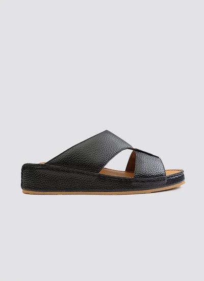 Men's black leather slide sandal with crisscross straps and textured sole on white background 