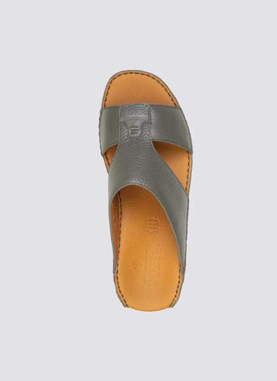 Top view of a grey leather men's sandal with tan cushioned insole and cross strap design 