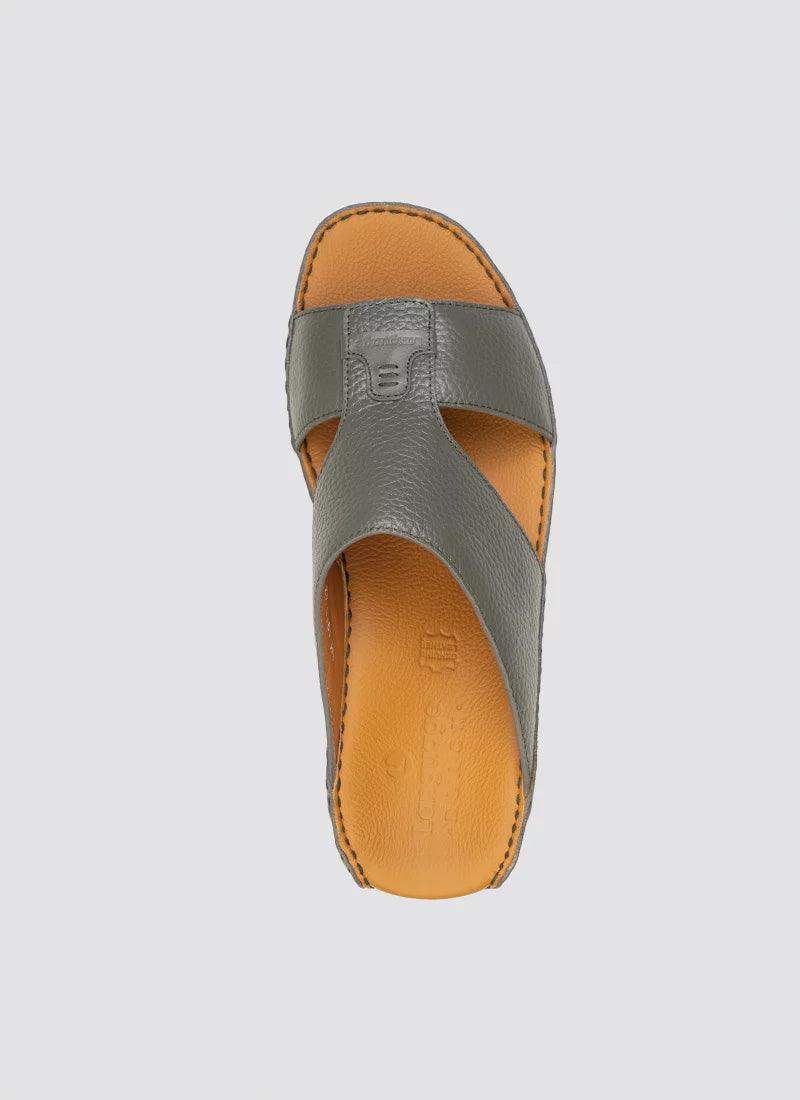 Top view of a grey leather men's sandal with tan cushioned insole and cross strap design 