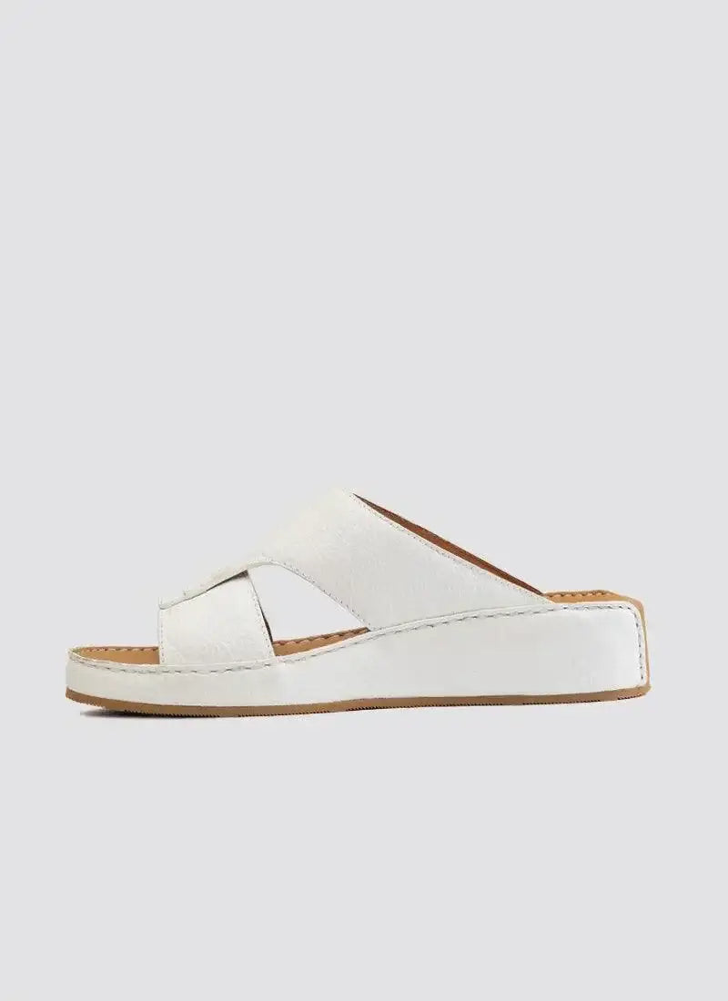 White leather slip-on sandal with wedge sole and cross-strap design for women 