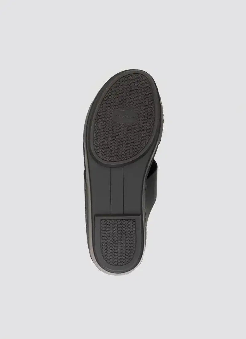 Close-up of black shoe sole with textured rubber grip, footwear for men and women 