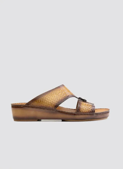 Tan brown slip-on sandal with textured snakeskin pattern and low wedge sole
