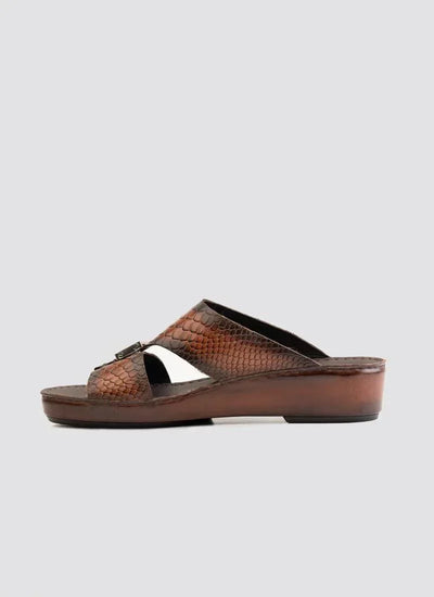 Brown textured men's leather slide sandal with low heel and cross strap design on white background