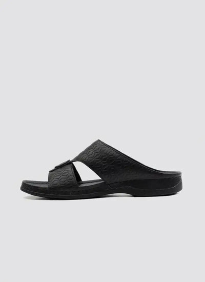 Men's black slip-on sandal with crossover textured straps and open toe on white background 