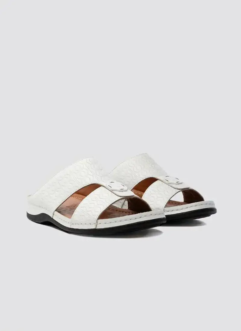 White open-toe leather sandals with textured pattern and black sole on light background 