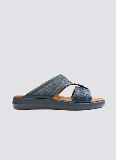 Navy blue men's slide sandal with textured leather straps and cushioned brown footbed. 