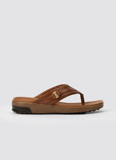 Men's tan leather thong sandal with cushioned sole and brown textured outsole 