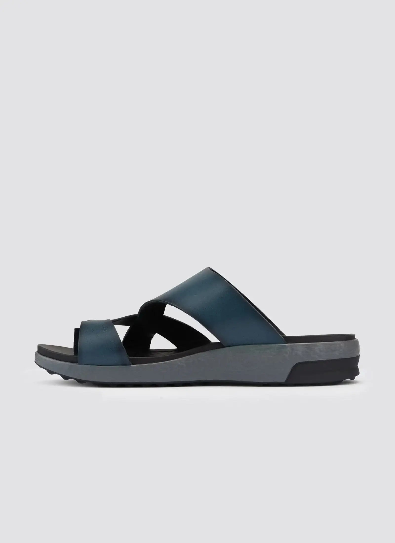 Men's navy blue slip-on sandal with criss-cross leather straps and cushioned sole 