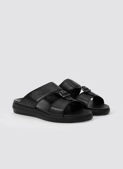 Black sandals on a light gray background 