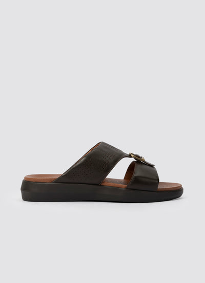 Black sandal with a strap on a light gray background 