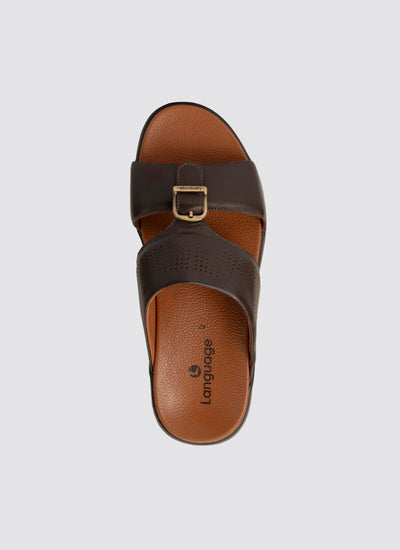 Brown sandal with a strap on a light gray background 