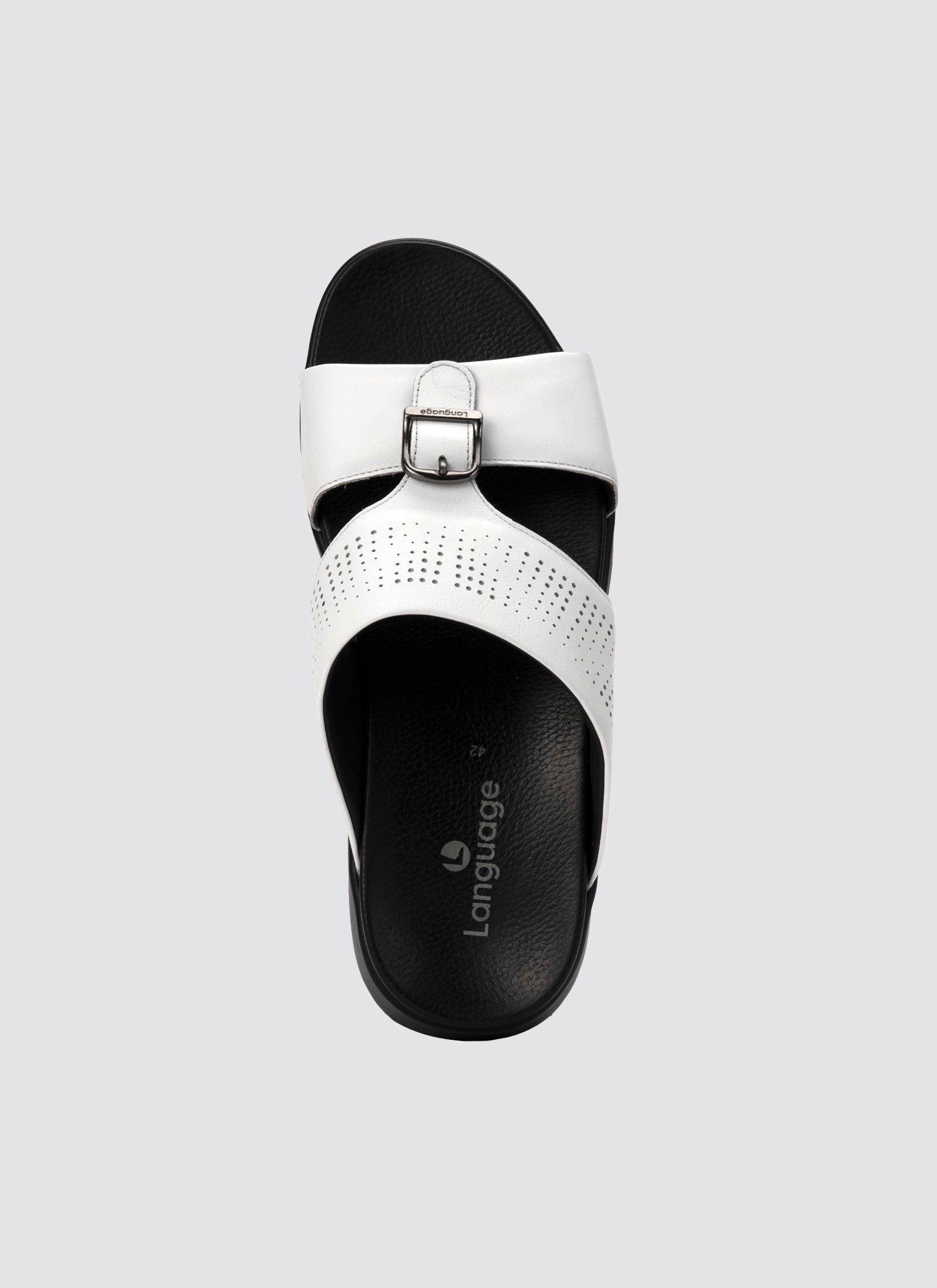 White sandal with black sole on a light gray background 