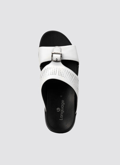 White sandal with black sole on a light gray background 