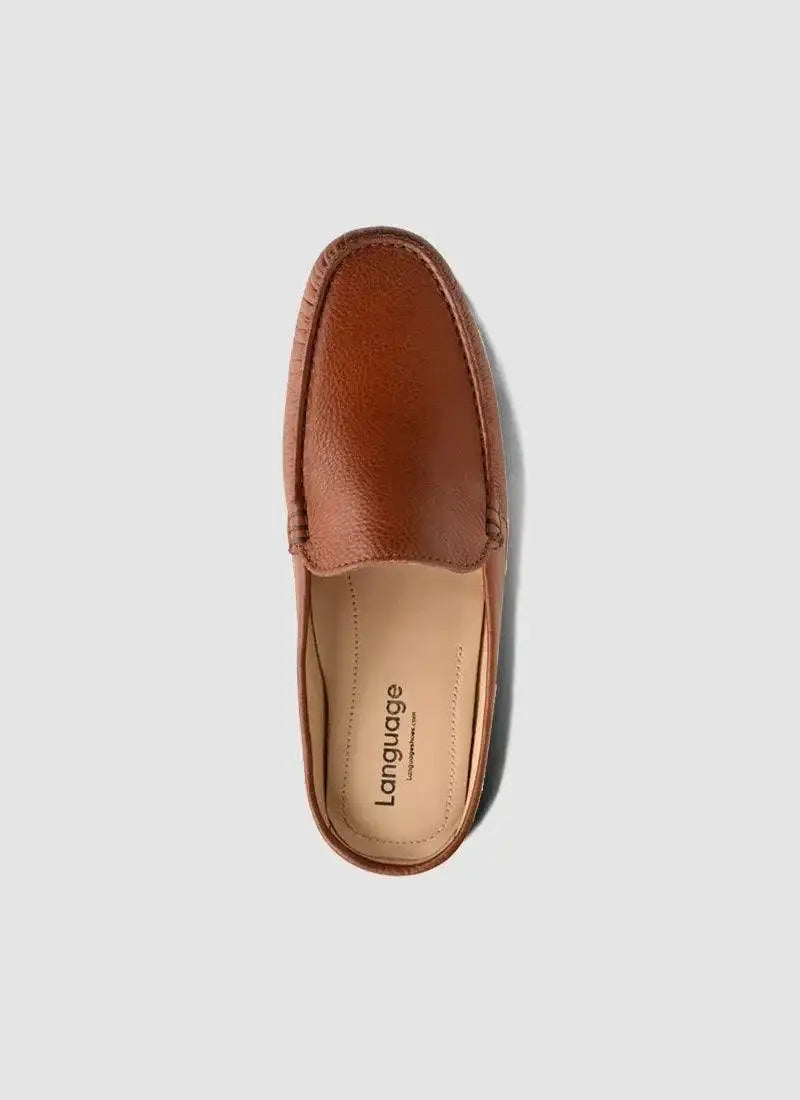 Tan brown leather loafer for men with textured upper, plain background, top view 