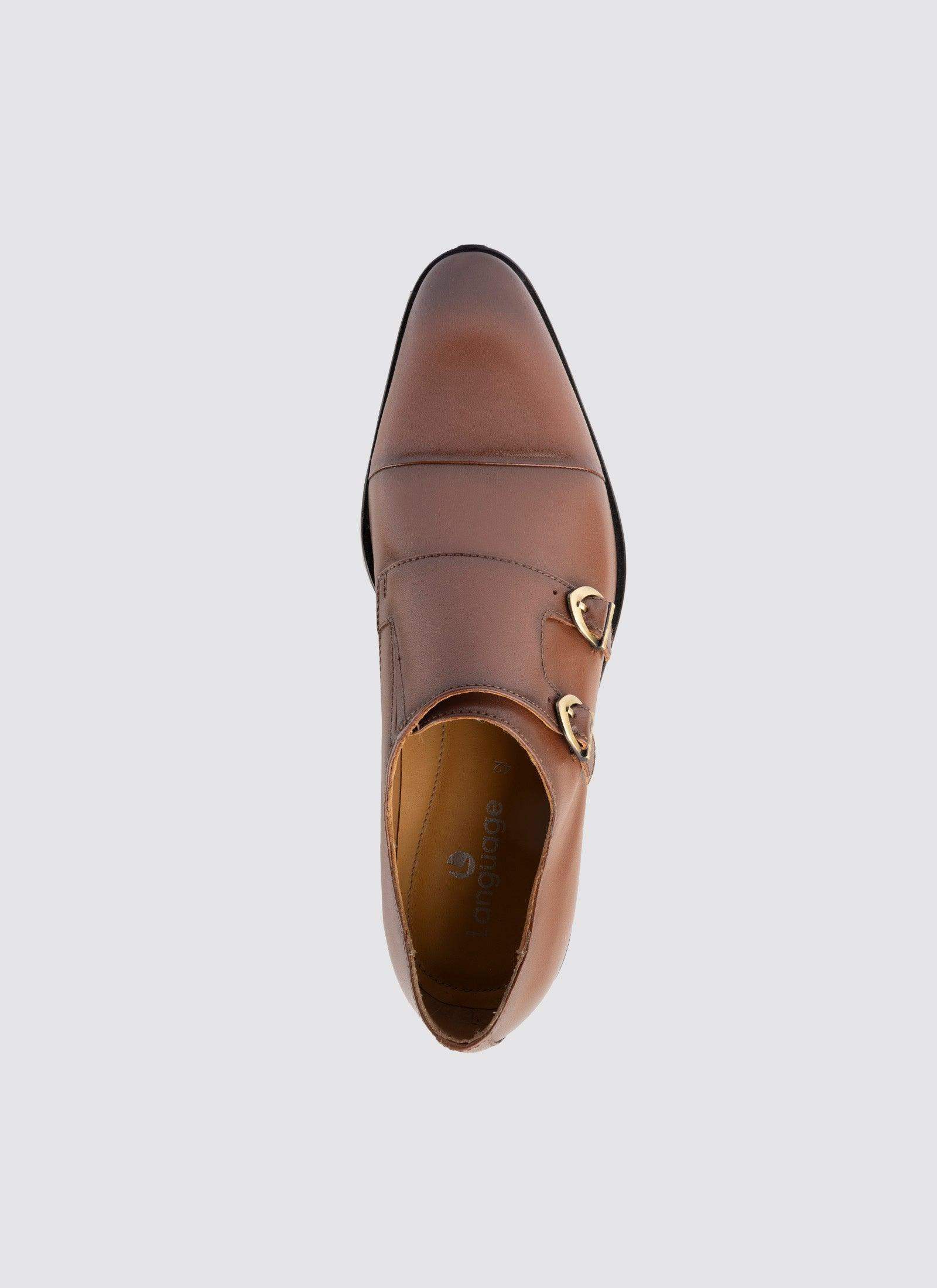 Tan leather double monk strap dress shoe for men, top view on white background  