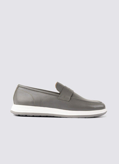 Men's grey leather loafer with white sole on plain background, casual footwear 